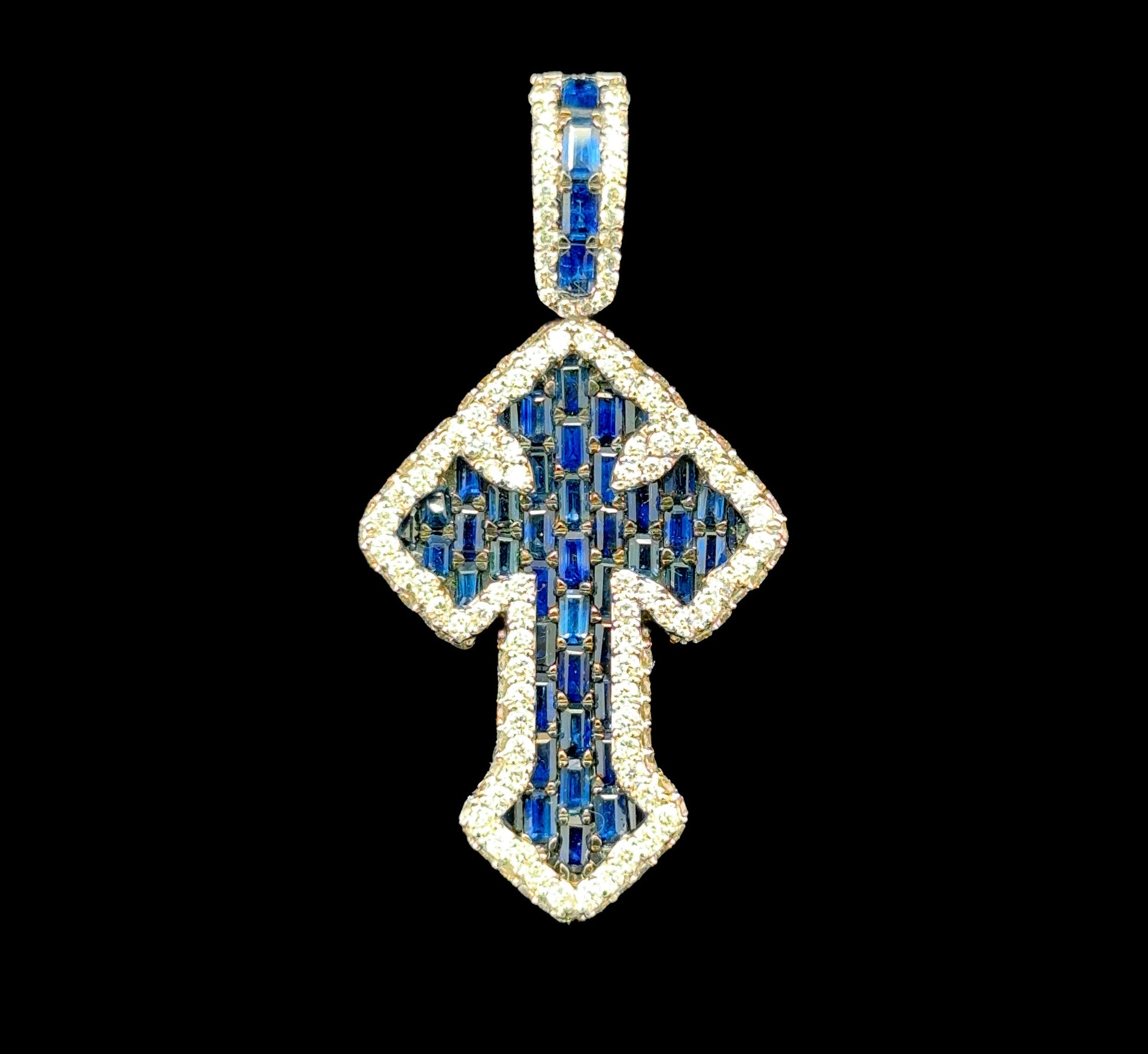 White gold cross pendant featuring 1.87 carats of diamonds and a 2.60ct sapphire.