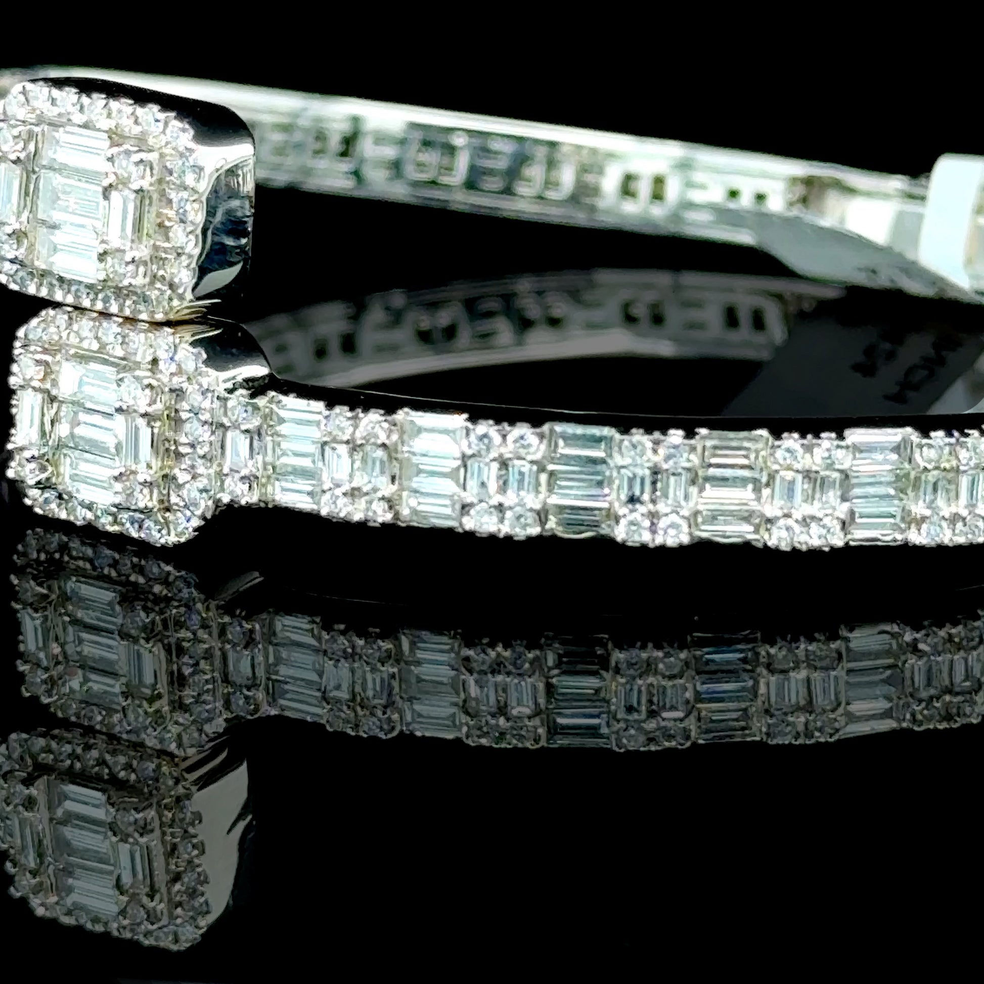 14K white gold diamond bangle with 6.88 carats of diamonds.