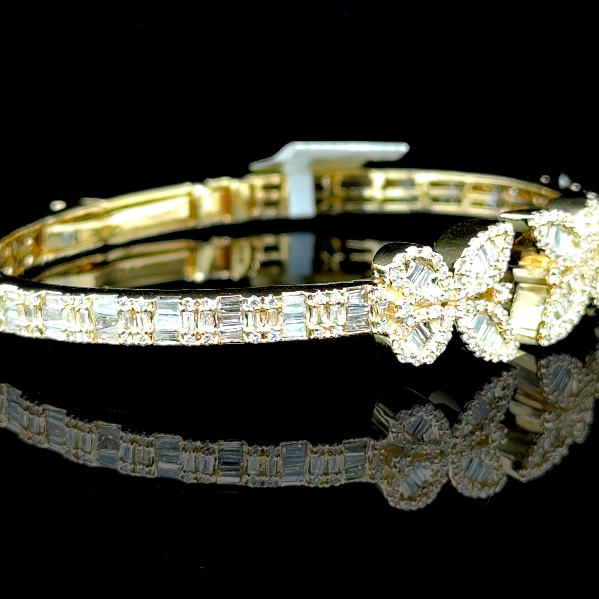 Yellow gold butterfly bangle with 2.19 carats of diamonds
