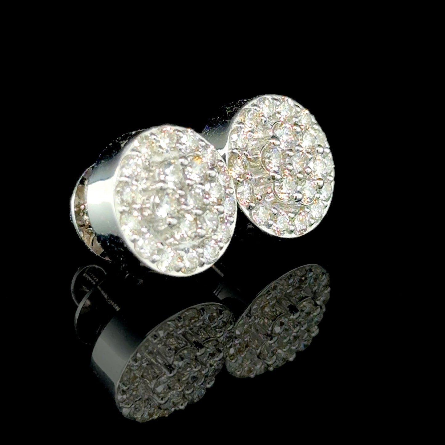 Everyday diamond earrings featuring round diamonds in a white gold setting.