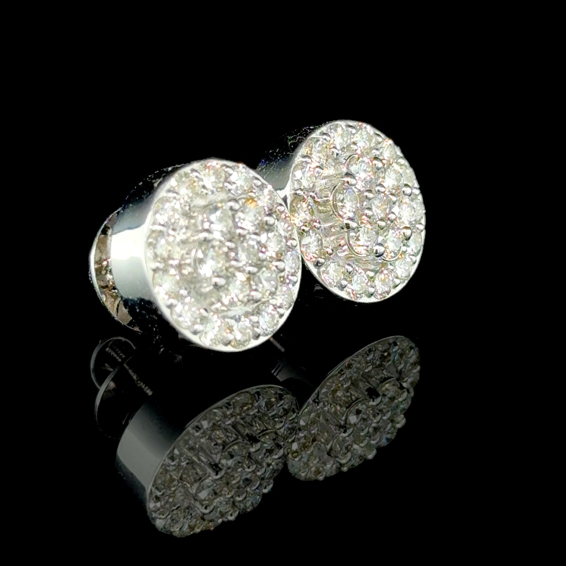 Everyday diamond earrings featuring round diamonds in a white gold setting.