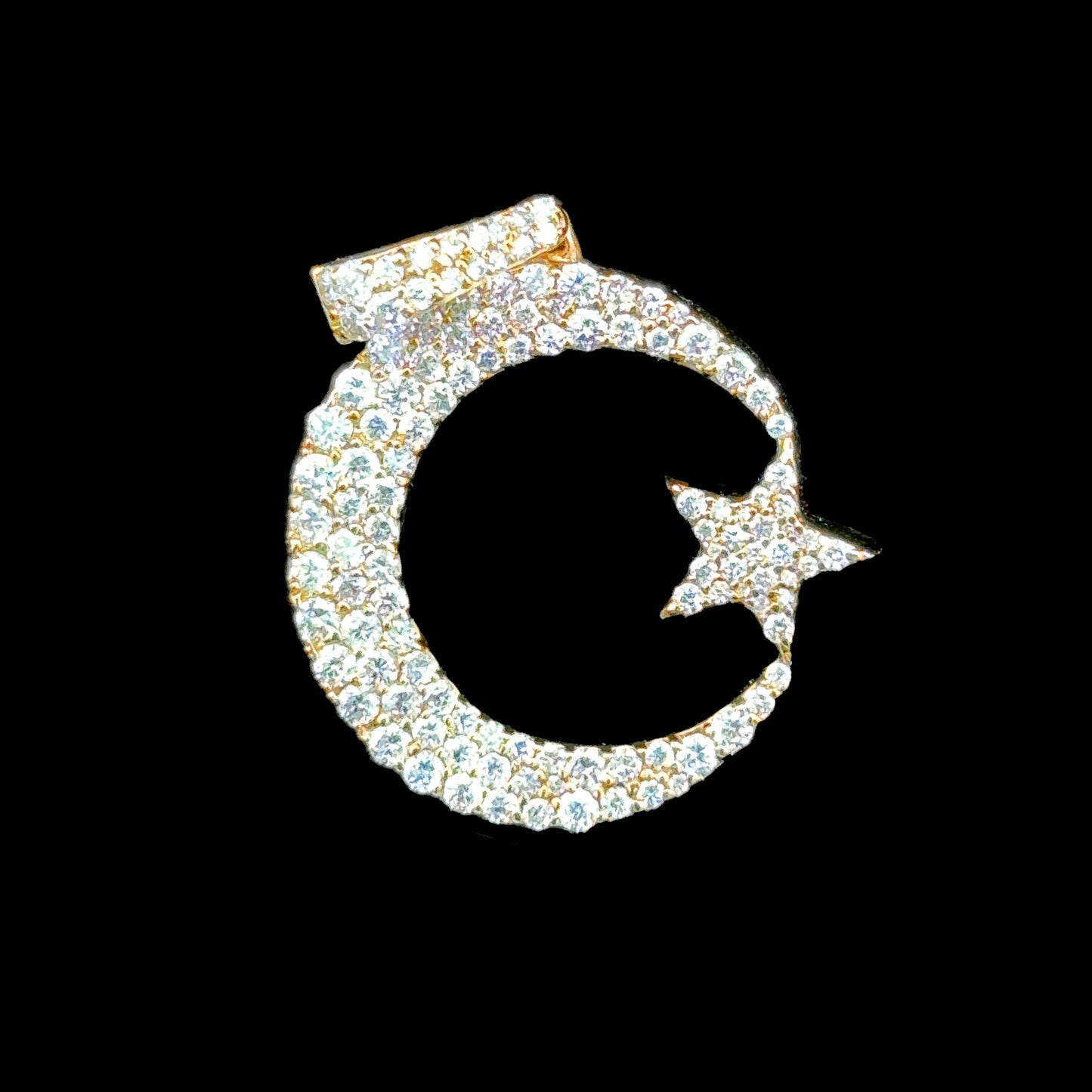 14K gold pendant with moon and star design, featuring sparkling diamonds.
