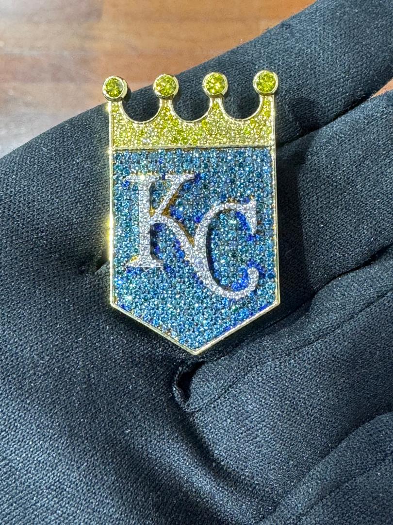 Custom 10K gold pendant featuring 3.81 carats of color diamonds. Solid gold back.