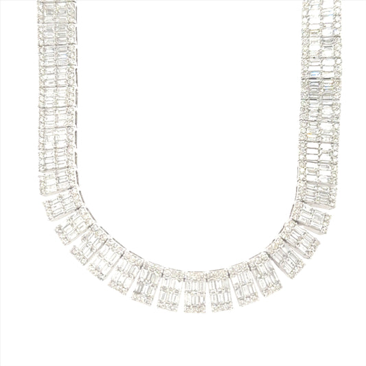 14K white gold tennis necklace featuring 19.50 carats of baguette-cut VS clarity, G color diamonds.