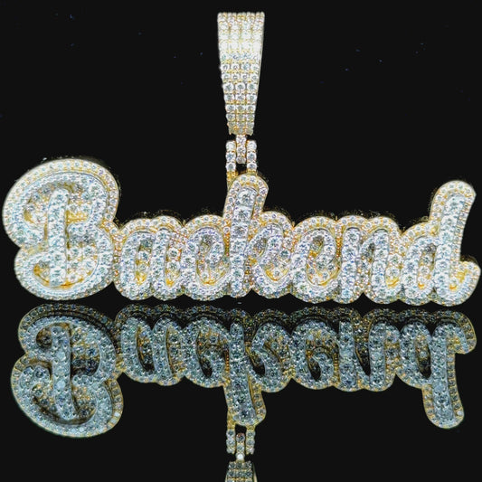 Customizable yellow gold pendant with the word "Backend" - diamond styles and gold karat can be chosen.
