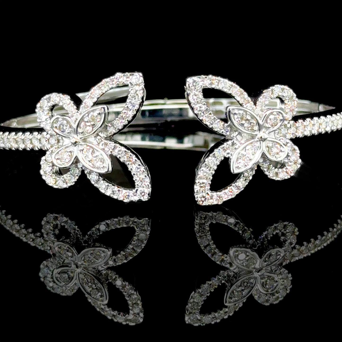 White gold butterfly bangle featuring 1.64 carats of diamonds