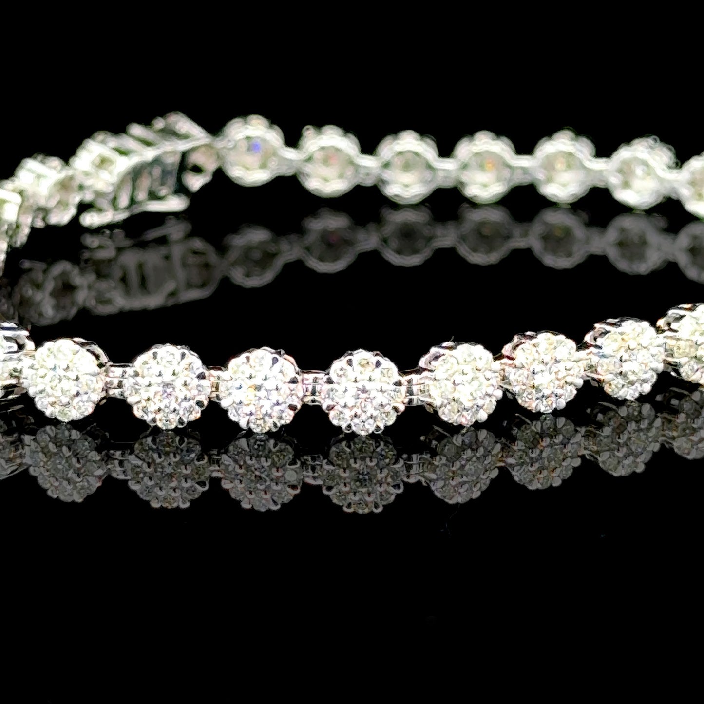 Floral bracelet with diamonds set in white gold.