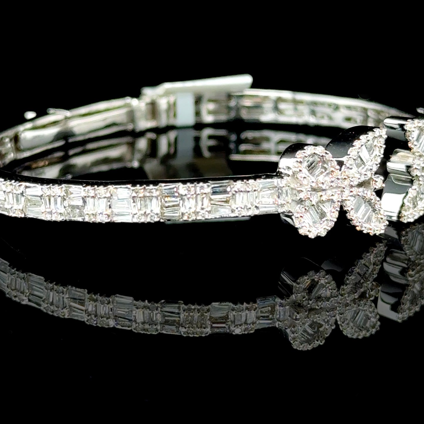 10K white gold bangle with a butterfly design and diamonds