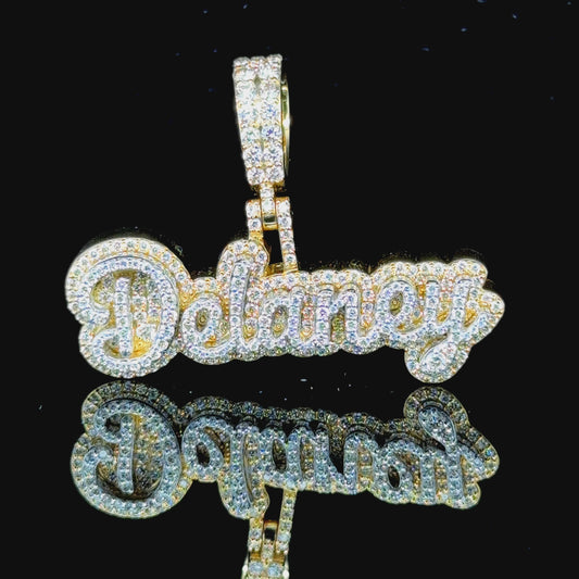 Customizable yellow gold name pendant, shown with "Delaney" as an example.