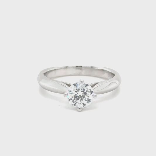 14K white gold engagement ring featuring a 0.50 carat round diamond with SI clarity and G color.