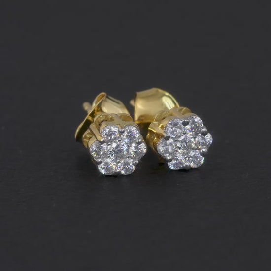 10K yellow gold earrings featuring 0.25 carats of VS clarity, G color diamonds in a flower setting.